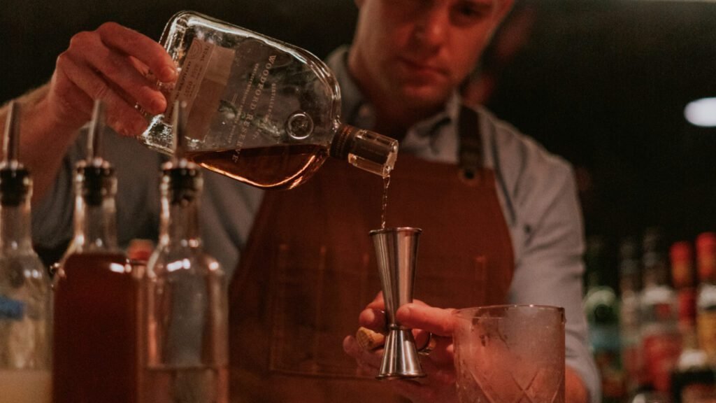 In this photo Dominic Bonadeo pours an old fashioned at our cocktail making class in New York City
