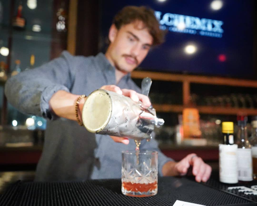 Danny Daquiry making an old fashioned at the crescent city cocktail class New orleans, LA